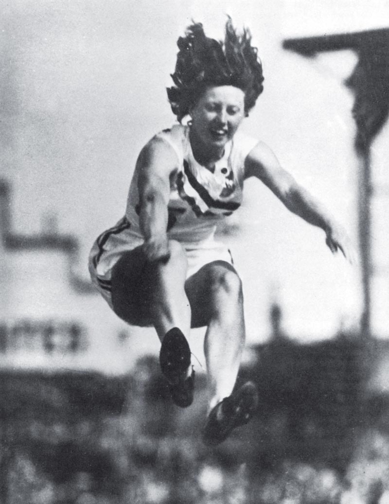 Yvette Williams jumps at a sports meeting in Carisbrook Park, Dunedin.