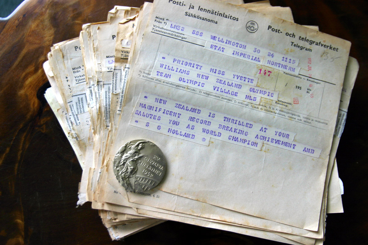 Yvette Corlett's gold medal and some of the telegrams that she received when she won.